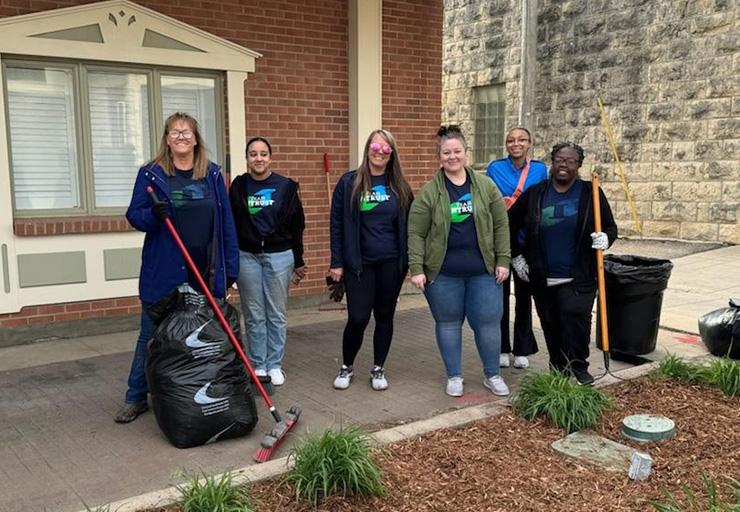 Employees participating in downtown clearnup