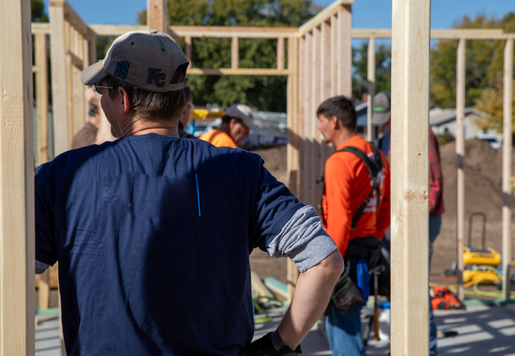 Employees working at a Habitat for Humanity build